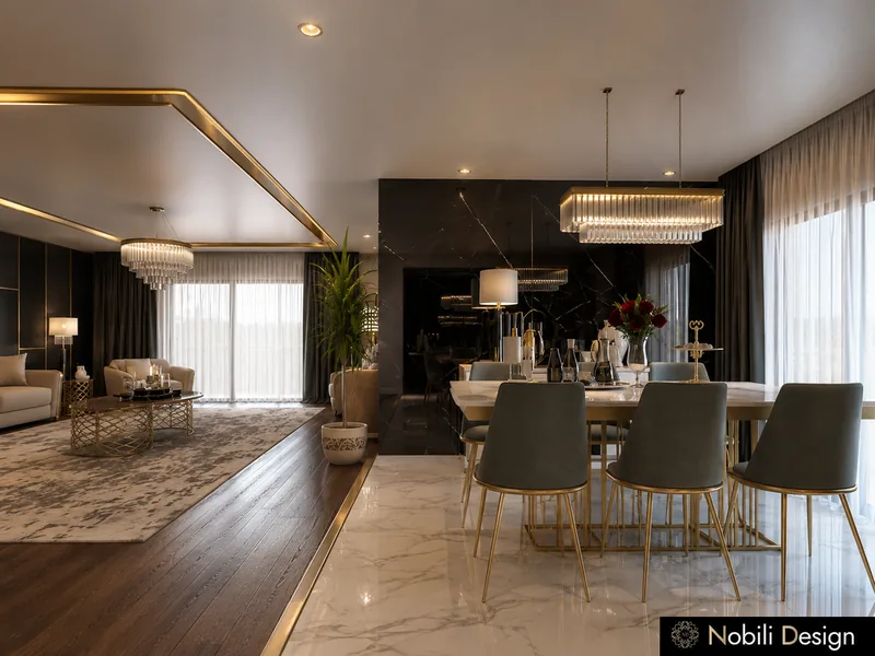 Modern dining room with marble table, grey velvet chairs, black marble wall and a crystal chandelier