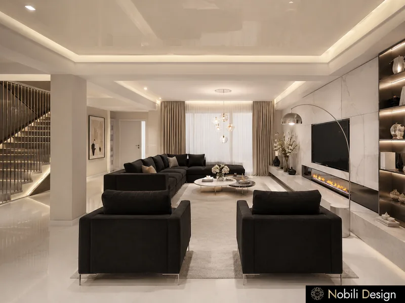 Modern living room with black sectional sofas, linear fireplace, floating staircase and lit niches