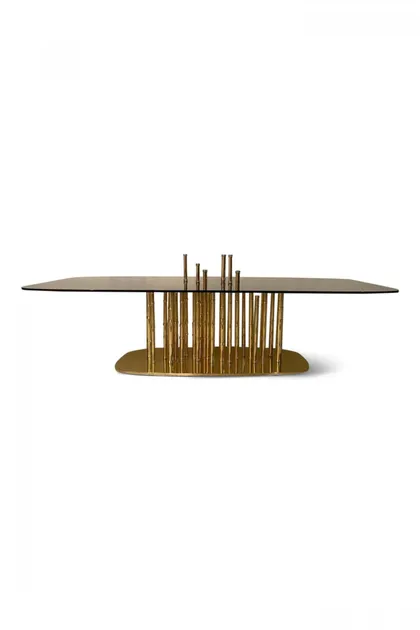 Exclusive Lotus coffee table with gold-plated bamboo details and a clear glass top for elegance.