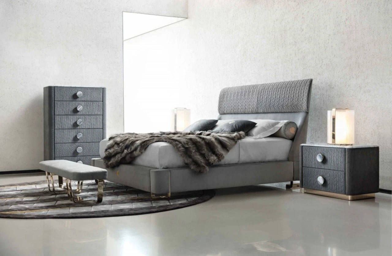 Bed with a pleated grey headboard, a bench and a matching chest, Italian furniture in Paris
